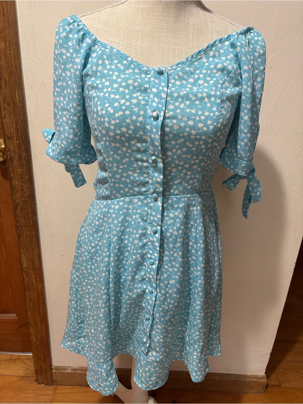 Woman’s size small dress in blue & white. Short sleeves with ties. Like new.